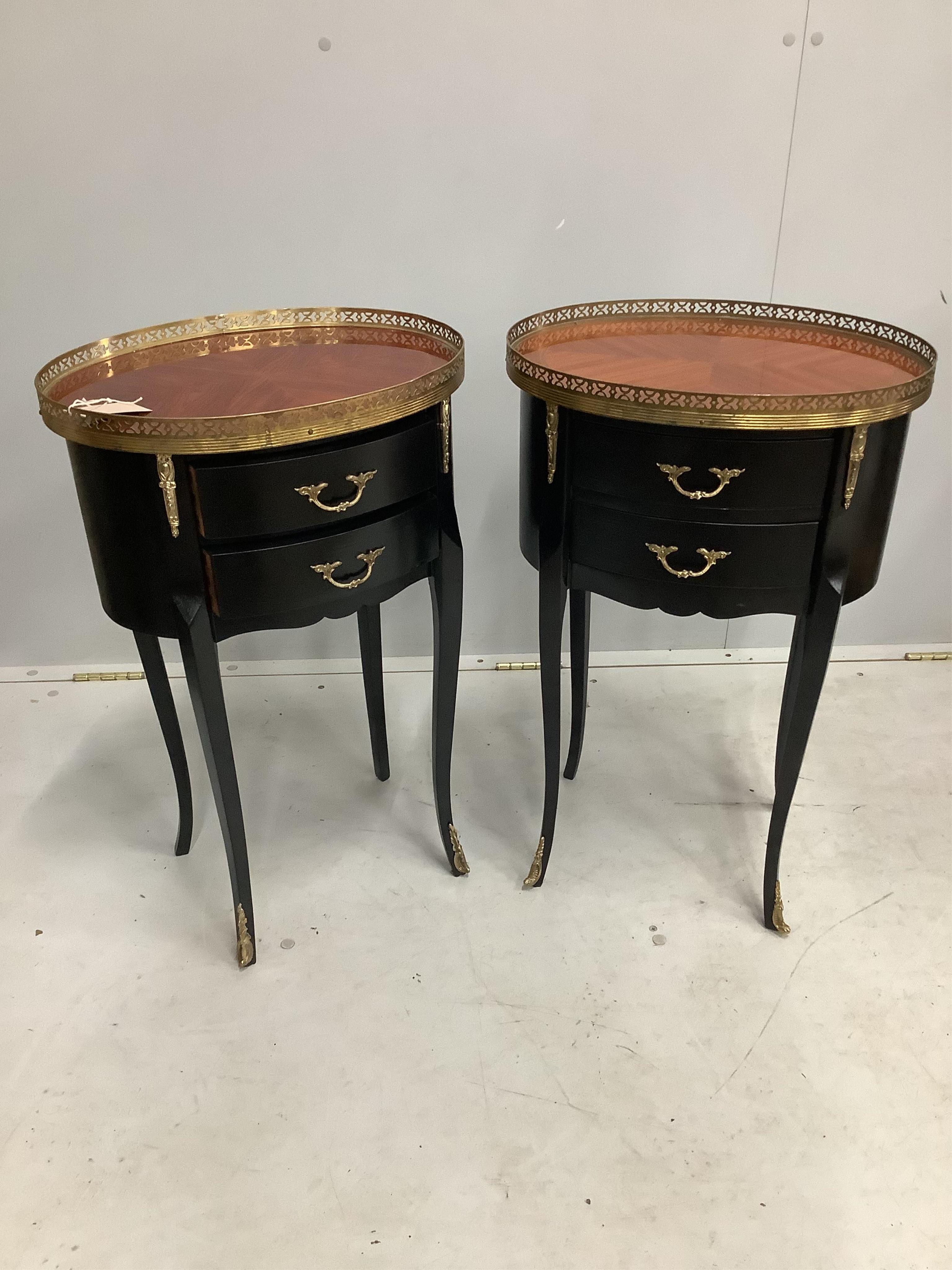 A pair of Continental ebonised occasional tables with brass galleries, width 42cm, depth 31cm, height 67cm. Condition - good